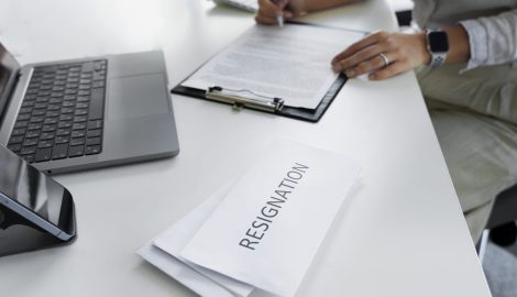 high-angle-woman-filling-document